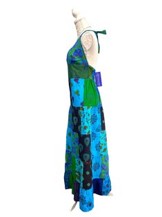 Brand New with tags Patchwork halter neck dressby Festival Stall One size S/M (UK 8 10 12 14) L/XL (UK 14 16 18) Get Festival ready with this stunning halter neck patchwork dress! With a smocked back it fits perfectly. Plunge neckline, with halter neck straps. Long length with flounced hemline section. This looks great worn with a little vest top underneath or a bandeau style bra top if you wish to show less cleavage. Length from top of bodice to hemline 56in (143cm) Length of halter straps 20in Blue Patchwork Maxi Dress For Summer, Halter Neck Patchwork Dress For Vacation, Patchwork Halter Neck Vacation Dress, Patchwork Halter Neck Dress For Vacation, Bohemian Fitted Maxi Dress With Floral Patchwork, Fitted Bohemian Maxi Dress With Floral Patchwork, Fitted Green Maxi Dress With Patchwork, Hippie Halter Neck Festival Dress, Bohemian Halter Dress For Festivals