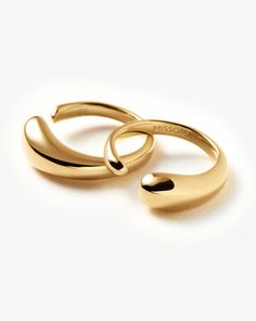 Molten Double Stacking Ring Set | 18ct Gold Plated. Make It Molten. This Organic-Inspired Ring Set Features Two Sculptural Bands that Fit Together to Create One Statement Ring. Style Separately or Stack Together. Metal: 18Ct Recycled Gold Plating on Brass Dimensions: 13. 7Mmx 5. 5mm Weight: 6. 6g Product Code: Or-G-R2-Ns Modern Yellow Gold Couple Rings With Ring Detail, Elegant Yellow Gold Couple Rings With Polished Finish, Elegant Yellow Gold Couple Rings Tarnish Resistant, Modern Yellow Gold Couple Rings, Modern Gold Couple Rings For Formal Occasions, Elegant Gold Couple Rings With Open Band, Elegant Gold Couple Rings With Polished Finish, Elegant Gold Open Band Couple Rings, 14k Gold Plated Rings