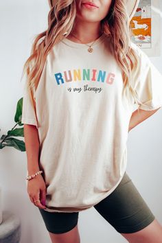 Cute running shirt for your favorite runner! SIZING This is a standard unisex size Comfort Colors Tee. For an oversized tee, please size up. If you are looking for an oversized "T-shirt Dress" look, we recommend sizing up 2 sizes. Please review the size chart to ensure you receive the fit you want. PRODUCT DETAILS The soft-washed, garment-dyed fabric brings extra coziness to your wardrobe while the relaxed fit makes it an excellent daily choice. The double-needle stitching throughout the tee makes it highly durable while the lack of side-seams helps the shirt retain its tubular shape. *100% ring-spun cotton *Heavy fabric (6.1 oz/yd² (206.8 g/m *Relaxed fit *Sewn-in twill label HOW TO ORDER 1.Please, check and review all photos. 2.Choose your size from the drop-down menu and add each shirt Marathon Shirts, Track Team, Running Gift, Running Track, Oversized T Shirt Dress, Running Gifts, Gifts For Runners, Team Shirt, Comfort Colors Tee