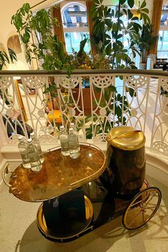 Vintage brass Art Deco style bar cart against the classic railing overlooking the lobby in the Georgian Hotel in Santa Monica. Bar Cart Aesthetic, Cart Aesthetic, Art Deco Bar Cart, Deco Bar, Art Deco Bar