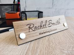 A beautiful, exclusive personalized desk stand with name. A perfect decoration for any office or anywhere where there is direct contact with the customer. Three types of beautiful wood to choose from. Each board has its own unique grain and color, which adds originality and character. Each name desk plaque is carefully hand-sanded and protected with colorless wood oil. Desk signs are made with a precise laser from solid wood and two metal supports.  Please write to us if you need signs in a diff Desk Signs, Engraved Name Plates, Office Desk Name Plates, Desk Plaques, Personalized Desk, Desk Name Plate, Desk Stand, Custom Desk, Desk Name