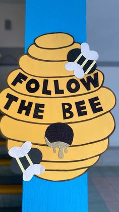 a sign that says follow the bee on it