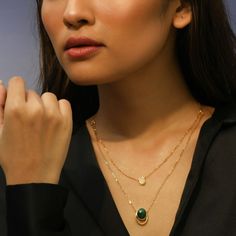 Description Inspired by the beautifully patterned Malachite gemstone, the earliest ore of copper, Tamra is eccentric, contemporary, and distinctively classy. Handcrafted on 925 hallmark silver and gold finish. This collection is curated for everyday luxury. This dual-layer chain necklace features an oval-cut malachite charm and an oval CZ charm suspended from a delicate chain. A striking necklace to style with Paksha's unmatched delicate jewelry. Product Information Materials used: 925 Silver wi Gold Oval Cabochon Necklace In Fine Jewelry Style, Fine Jewelry Gold Oval Cabochon Necklace, Modern Gold Jewelry With Oval Cabochon, Natural Stones Necklace With Oval Cabochon, Polished Finish Oval Cabochon Necklace, Elegant Oval Emerald Necklace With Natural Stones, Elegant Gold Oval Emerald Necklace, Luxury Gold Oval Emerald Necklace, Luxury Oval Gold Emerald Necklace