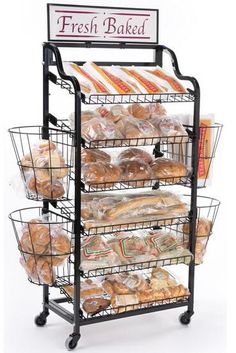 a bakery rack with breads and pastries on it's sides, labeled fresh baked