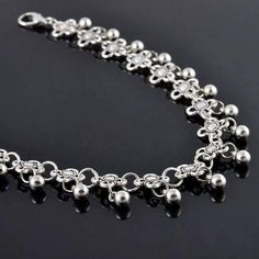 A classic silver chain ankle bracelet with tiny silver beads in the tradition of India and Eastern Asia. Traditionally worn by brides and belly dancers, this exotic but feminine bracelet is just the accessory for a summer look. Light and airy with delicate movement of the beads, its a perfect accessory for your beach ensemble! Can be worn loose as a bracelet or fit larger wrists Anklet for Women foot wear Occasion: Everyday wear, Beach Wear, Special Events, Bridal Accessory, Belly dancer accesso Anklet Jewellery Sterling Silver, Silver Bohemian Metal Anklets, Silver Beaded Festival Anklets, Silver Beaded Anklets For Festival, Silver Adjustable Chain Metal Anklet, Silver Adjustable Chain Anklet, Silver Adjustable Chain Anklets In Metal, Festival Silver Beaded Anklets, Silver Beaded Toe Ring Anklets