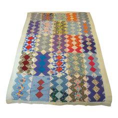 a multicolored rug with many different patterns on the bottom and one in the middle