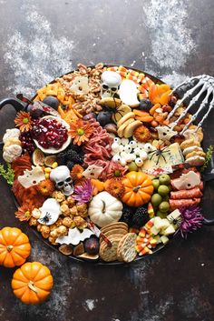 a platter filled with halloween food on top of a table next to a fork