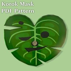 a green mask with leaves on it and the words korok mask pdf pattern