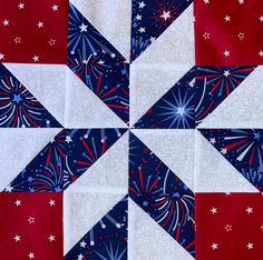 a red, white and blue quilt with stars on the top is featured in this image