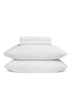 three white pillows stacked on top of each other