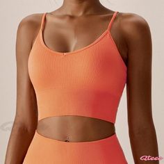 Qteee - Seamless Yoga Sports Bra for Running and Fitness Activities, Moisture-Wicking and Body-Hugging Yoga Apparel Orange Yoga Tops, Orange Stretch Yoga Tops, Orange Stretch Tops For Yoga, Stretch Orange Yoga Tops, Orange Stretch Sports Tops, Orange Stretch Tops For Sports, Stretch Orange Tops For Sports, Sporty Orange Seamless Top, Sporty Seamless Orange Top