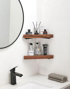 a bathroom sink with two wooden shelves above it