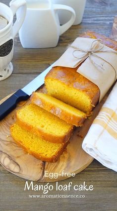 slices of lemon pound cake on a cutting board next to a knife and coffee mug