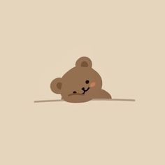 a brown teddy bear sitting on top of a floor