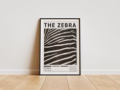 a zebra print on the wall next to a wooden floor