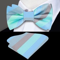 Elevate Your Style with Our Pastel Blue Striped Silk Bow Tie Looking for a charming accessory to add to your wardrobe? Our shades of pastel blue striped silk bow tie is the perfect choice! Available as a self-tie or pre-tied option, this bow tie fits neck sizes from 14" to 22" inches and comes with a matching pocket square for a coordinated look. Styling Suggestions: Dress Shirts and Suits Dress Shirts: Crisp White Dress Shirt: Create a classic and polished ensemble that lets the pastel blue str Shades Of Pastel Blue, Purple Bow Tie For Party, Lavender Bow Tie, Purple Party Bow Tie, Classic Blue Bow Tie With Butterfly Knot, Adjustable Blue Bow Tie, Shades Of Pastel, Light Grey Dress, Grey Shirt Dress