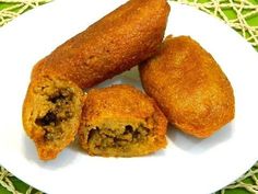 three fried food items on a white plate