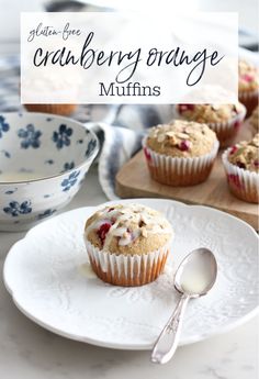 muffins with cranberry orange filling on a plate next to other muffins