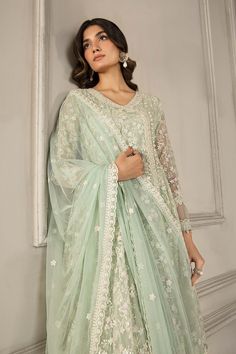 Classic Light Green Shade Maria B Luxury Formal Pakistani Salwar Suit creating a mesmerizing tapestry of floras with delicate threads and sequins. Delivery: 7 Business Days Detailed Description: SKU: PB781 Detailing: Embroidery, Threads Color: Light Green Fabric: Net, Organza Design: Fully Embroidered dress Event: Festive, Party wear Light Green Desi Outfit, Sage Green Pakistani Dress, Festive Floral Embroidered Salwar Kameez For Reception, Festive Floral Embroidery Salwar Kameez For Reception, Light Green Dress Outfit Wedding, Green Salwar Kameez With Floral Embroidery For Reception, Festive Unstitched Suit With Floral Embroidery For Reception, Bollywood Style Floral Embroidered Salwar Kameez For Reception, Floral Embroidered Salwar Kameez For Eid Reception