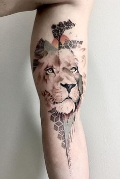 a man with a lion tattoo on his leg and the other side of his arm