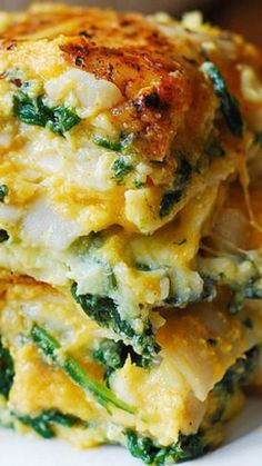 there are three pieces of food stacked on top of each other with cheese and spinach