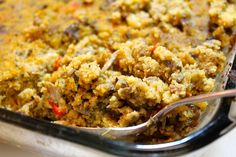 a casserole dish with spoons in it