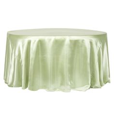 a round table with a light green cloth on it