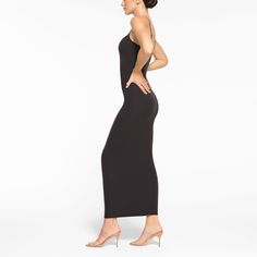 Everything you love about our signature Fits Everybody collection, now in an ultra-flattering dress. This double-lined silhouette is made to hug your body and offer a snatched, smoothed look. Fits true to size. | SKIMS Long Slip Dress | Black | Small | Fits Everybody Chic Sleeveless Slip Dress With Smoothing Feature, Chic Sleeveless Smoothing Slip Dress, Chic Sleeveless Slip Dress With Smoothing, Chic Seamless Midi Dress For Night Out, Chic Seamless Stretch Dress, Sleek Bodycon Dress With Flattering Silhouette, Chic Sleeveless Slip Dress With Smoothing Details, Stretch Seamless Midi Dress, Seamless Sleeveless Bodycon Dress For Evening