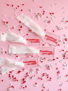 red and white confetti on pink background with tags that say something to avoid