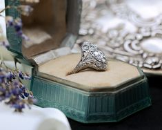 A shield ring is a remarkable piece of jewelry that embodies the elegance and artistry of the Art Deco era. Its combination of vintage diamonds, intricate filigree work, and timeless design makes it a treasured and captivating example of antique craftsmanship. Era: This ring is from the Art Deco era (1920s-1930s), known for its geometric and symmetrical designs, blending elegance with modernism. Material: The band is crafted from platinum, a precious metal known for its durability and luxurious Heirloom Style Diamond Ring Gift, Heirloom Style Diamond Ring As A Gift, Silver Rings With Certificate Of Authenticity As Gift, Victorian Signet Ring For Wedding With Intricate Design, Luxury Formal Signet Ring With Intricate Design, Victorian Wedding Signet Ring With Intricate Design, Luxury Oval Signet Ring With Intricate Design, Luxury Diamond Cut Collectible Rings, Classic Engraved Ring With Intricate Design For Collectors