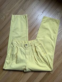 READ ALL DETAILS BEFORE PURCHASING...Pretty please. MEASUREMENTS: ~ Waist 27" ~ Hip 38" ~ Rise 12" ~ Inseam 28" ~ Tag Size: 10 *COMPARE PERSONAL MEASUREMENTS FOR PROPER FIT ITEM DETAILS: Cross between sunshine & butter yellow in color, high waist, pleated front, relaxed through hips, slight tapered leg, material is medium weight - Made in usa ~ Era: 80's  ~ Brand: no brand tag ~ Material: 100% cotton ~ Style: Indie / Preppy Streetwear / Momcore ~ Condition: Good - no flaws Need more information? Just ask, here to help! Perfectly imperfect vintage charm may exist, but that's the sustainability appeal! Tag Photo, Brand Tags, Perfectly Imperfect, Trouser Pants, Cotton Style, Trousers Women, Butter, Trousers, High Waisted