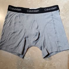 Gray Boxer Briefs By Calvin Klein. Logo Waistband. 57% Cotton/ 38% Polyester/ 5% Elastane Nwot Fitted Calvin Klein Boxer Briefs, Calvin Klein Casual Boxer Briefs For Loungewear, Casual Calvin Klein Boxer Briefs For Loungewear, Calvin Klein Casual Boxer Briefs, Calvin Klein Casual Multi-pack Bottoms, Calvin Klein Cotton Boxer Briefs For Loungewear, Calvin Klein Cotton Boxer Briefs For Sports, Casual Calvin Klein Cotton Boxer Briefs, Calvin Klein Casual Cotton Boxer Briefs