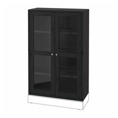 a black cabinet with two glass doors on the front and one door open to show it's contents