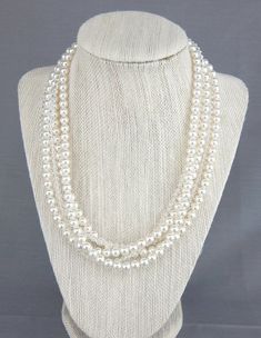 Statement pearl necklace, multi strand chunky pearl and crystal wedding jewelry.   Wedding jewelry and bridal accessories by Celebrating Together.  #statementneckace #weddingjewelry #pearlnecklace #crystalnecklace #chunkybridalnecklace #statementjewelry Statement Pearl Necklace, Multi Strand Pearl Necklace, Bride Necklace, Chunky Pearls, Pearl Statement Necklace, Wedding Accessories Jewelry