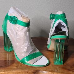 Gianni Bini, The Liyra Clear Ankle Strap Block Heel Sandals Clear Synthetic Upper Ankle Strap With Buckle Closure Unlined Memory Foam Sock Synthetic Outsole Approx. 3.93" Clear Heel Height One Size 7 Left Brand New In The Box Party Sandals With Clear Ankle Strap, Party Ankle-high Sandals With Wrapped Heel, Trendy Green Heels With Buckle Closure, Green Open Toe Heels For Party, Chic Green Heels With Buckle Closure, Green High Heel Sandals With Wrapped Heel, Green High Heel Sandals With Buckle Closure, Green Formal Sandals With Buckle Closure, Formal Green Sandals With Buckle Closure