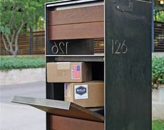 an open mailbox with boxes in it