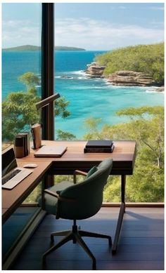 a desk with a laptop on it in front of a large window overlooking the ocean