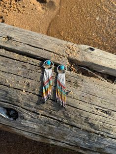 These Halo earrings are among my favorites. They feature Kingman Turquoise set in scalloped fine silver with a sterling hoop. These are handmade from raw silver in my studio, then hand beaded by me, bead by bead. These also feature sterling silver tube beads.  Photographed at Priest Lake in Northern Idaho.  Please follow along here and on Instagram @NatPBrightsmithing All of my handmade, silver smithed jewelry  is unique. Even between earrings in a pair. There may be small imperfections and variations and these are the things that make handmade jewelry beautiful and one of a kind. I hope you love what you see. Northern Idaho, Halo Earrings, Jewelry Beautiful, Earrings Turquoise, Kingman Turquoise, Half Dollar, Tube Beads, Hand Beading, My Favorites