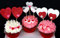 three cupcakes decorated with pink and white frosting