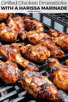 grilled chicken drumsticks with a marinade on the grill and text overlay that reads grilled chicken drumsticks with a harisa marinade