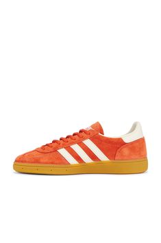 Suede and leather upper with rubber gum sole.  Made in Vietnam.  Lace-up front.  Signature adidas side stripes.  Printed Spezial logo at outer panels.  Padded low-cut collar.  .  .  .  .  .  .  .  .  .  . Classic Orange Sneakers With Rubber Sole, Retro Leather Sneakers With Three Stripes, Retro Orange Leather Sneakers, Casual Sneakers With Side Stripes For Streetwear, White Crystal, Side Stripe, Cream White, Low Cut, Adidas Originals