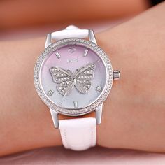 This is a unique butterfly design printed on the dial of this watch to add a touch of sophistication. Centre stage is our silver butterfly encrusted with shimmering stones and framed by sparking markers on a beautiful ombre dial of pale pink fading into sage. Finished with a white leather strap, this timepiece and its muse are truly one of a kind.Watch Strap Color: WhiteStrap Inner Circumference: 175+/-5 mmStrap Width（mm）: 16 Strap Material: LeatherClasp Type: BuckleCase Size: 41.76 mmCase Thick Diamond White Watches With Rhinestones For Gift, White Diamond Watch Gift, Rhinestone Watches With Round Dial, Rhinestone Watches Perfect As Gifts, Diamond White Quartz Watch For Gift, Diamond White Quartz Watch As Gift, Diamond-studded White Watch As Gift, White Diamond Watch With Metal Dial For Gift, Butterfly Watch