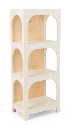 a white wooden shelf with three shelves on each side and four holes in the middle