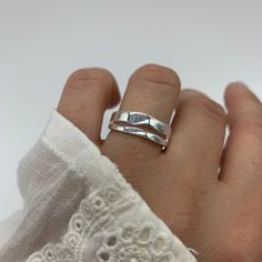 SILVER DOUBLE LAYER RING 🧡 Enhance your summer style with our stunning Silver Double Layer Ring. This stackable, adjustable ring is the perfect accessory to elevate any outfit. Designed with a thick band and a layered look, it exudes modern elegance and versatility. Whether you wear it as a thumb ring or layer it with other favorites, this piece is sure to turn heads. 🧡 Crafted with care, this ring makes a thoughtful birthday gift or a special treat for yourself. Its adjustable feature ensures a comfortable fit, accommodating different finger sizes. The high-quality silver material adds a touch of luxury and durability, ensuring it lasts for seasons to come. 🧡 Don't miss out on the opportunity to add a touch of sophistication to your jewelry collection. Order our Silver Double Layer Rin Adjustable Metal Ring Jewelry For Summer, Trendy Adjustable Stackable Rings For Anniversary, Trendy Open Ring Summer Jewelry, Silver Jewelry For Everyday Summer Wear, Stackable Jewelry As Summer Gift, Summer Stackable Jewelry As Gift, Trendy Adjustable Sterling Silver Rings, Trendy Adjustable Rings For Summer, Trendy Open Ring For Summer