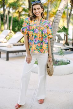 Moving forward, we can be that this is going to be so in love with this blouse! Those colors are so pretty together and we love that babydoll cut. This blouse is going to be a warm weather favorite! V-neckline Short bubble sleeves Floral print Babydoll cut No stretch Savannah is wearing the small. Summer V-neck Blouse With Tropical Print, Multicolor Floral Print V-neck Peasant Top, Cotton V-neck Peasant Top For Vacation, Floral Print V-neck Peasant Top For Beach, Relaxed Fit Split Neck Vacation Blouse, Relaxed Split Neck Blouse For Vacation, Relaxed Fit Split Neck Blouse For Vacation, Vacation Floral Print Blouse With Split Neck, Vacation Puff Sleeve Blouse