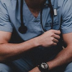 a man with a stethoscope sitting down