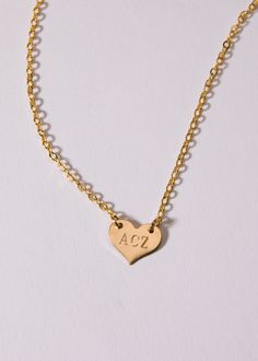 Engraved Heart Gold Heart-shaped Stamped Jewelry, Gold Heart Necklace As Personalized Gift, Everyday Gold Engraved Heart Necklace, Valentine's Day Personalized Tarnish-resistant Necklace, Gold Heart Charm Necklace With Nameplate, Gold Double Heart Necklaces With Initials, Heart-shaped Engraved Initial Necklace For Anniversary, Gold Engraved Heart Pendant Initial Necklace, Gold Heart Initial Necklace For Anniversary