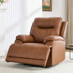 a brown recliner chair sitting in a living room