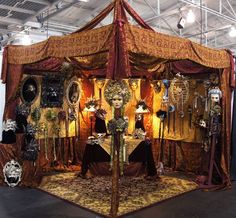 an elaborately decorated display in a building with many items on the floor and walls