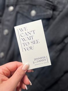 someone holding up a card that says we can't wait to see you